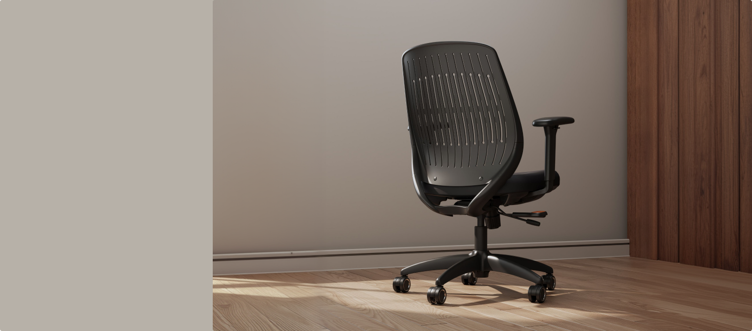 ErgoStretch black office chair with ventilated backrest, displayed in a modern home office.