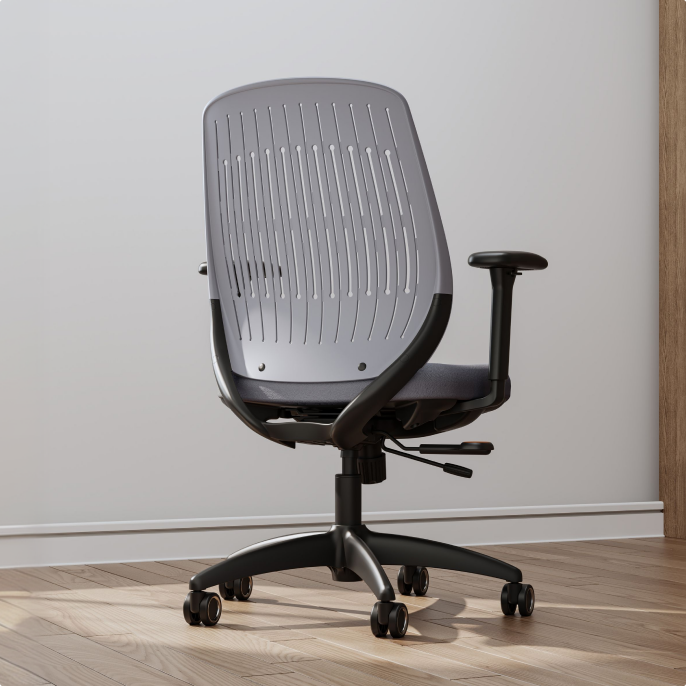 ErgoStretch gray office chair with ventilated backrest, displayed in a modern home office.