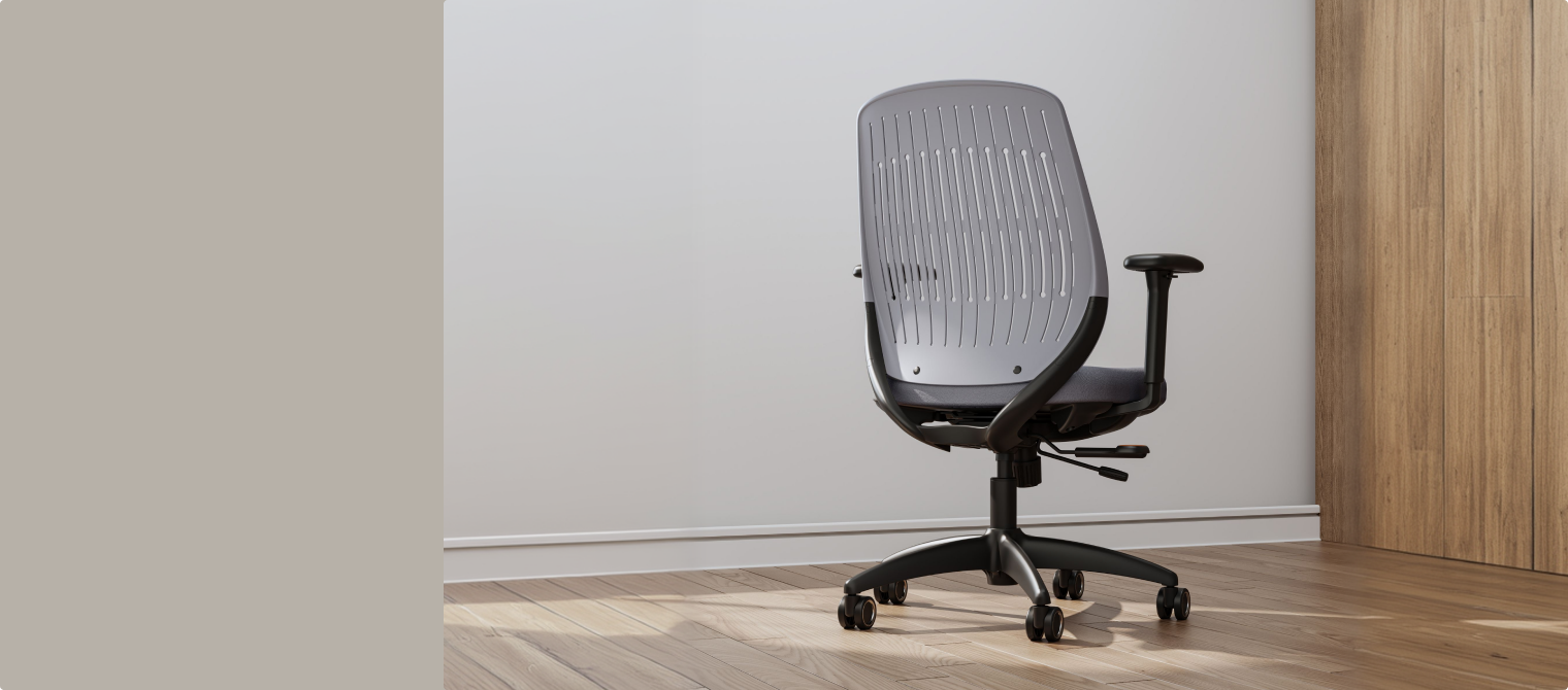 ErgoStretch gray office chair with ventilated backrest, displayed in a modern home office.