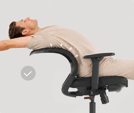 Man stretching safely on the ErgoStretch office chair, with even back support preventing waist strain.