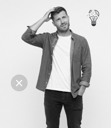 Frustrated man struggling with focus, showing how standing to stretch interrupts workflow.