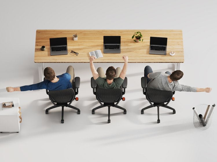 Three men using ErgoStretch chairs in an office, showing the flexible, supportive backrest during different stretches.